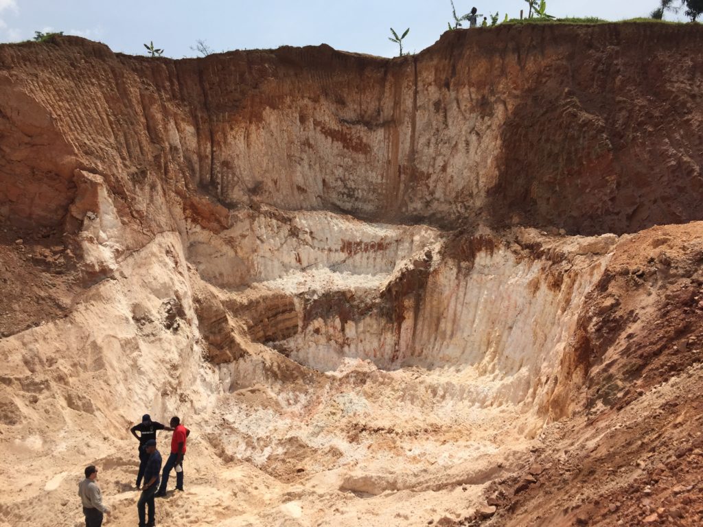 LCT pegmatite mining in Rwanda. Note the horizontal dimensions of the ore body and strong weathering (image - )