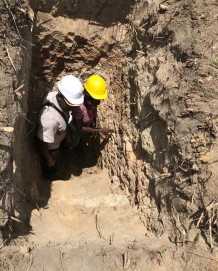 IronRidge Resources - geologists inspecting subcrop within a pit